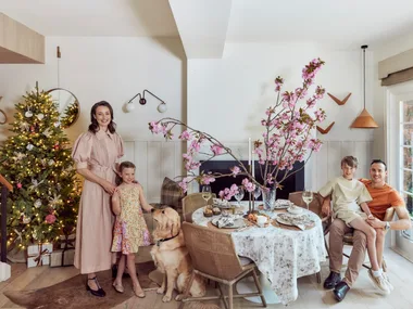 Kate Nixon with her family in front of her Christmas Tree