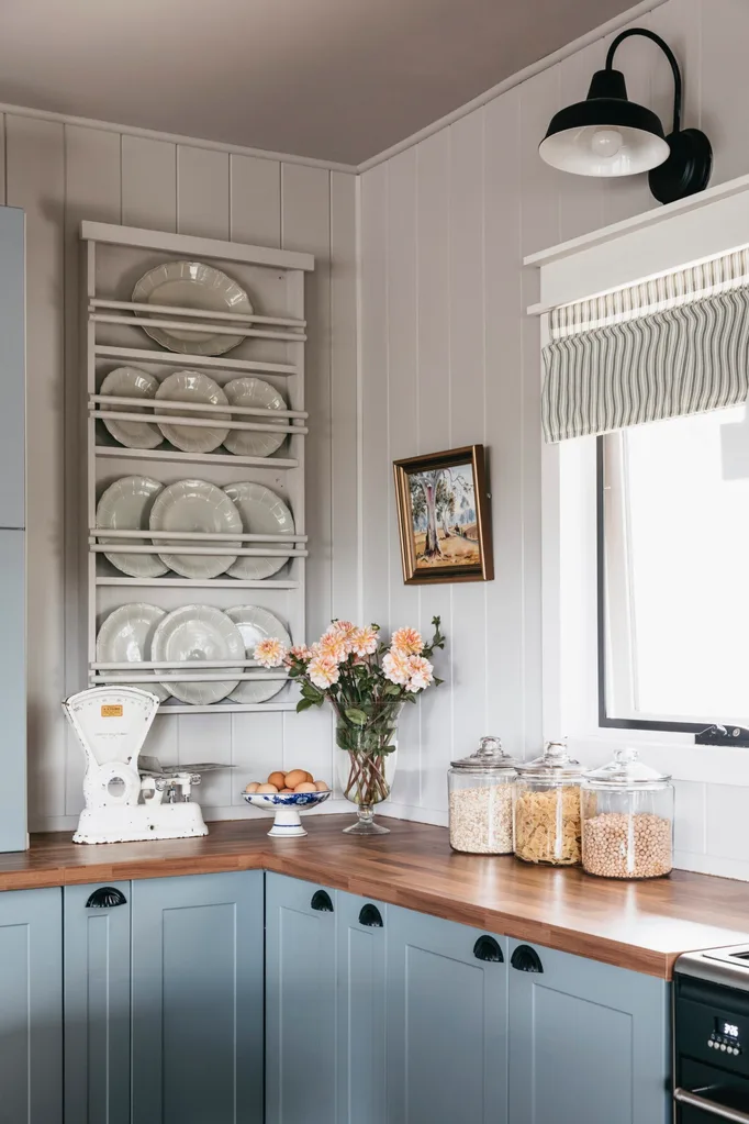 Modern farmhouse kitchen with plates.