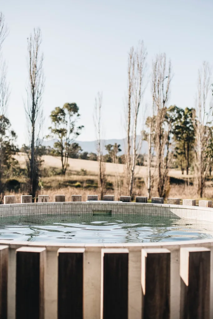 Mineral pool with hardwood timber battens around the outside
