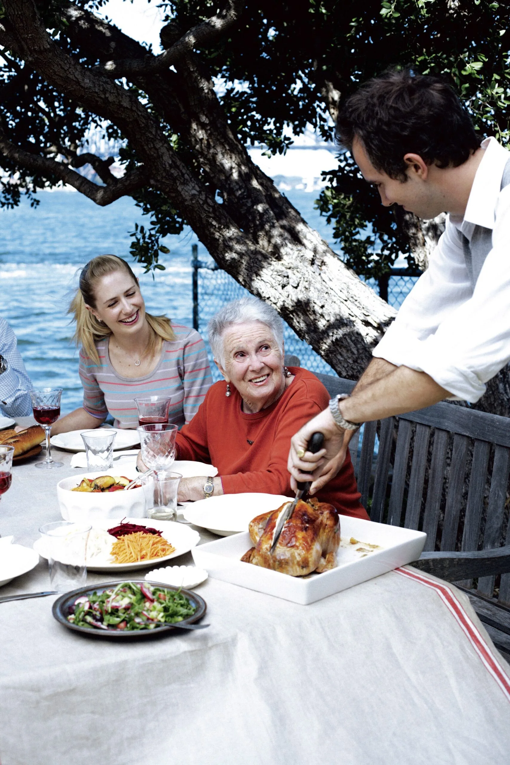 Margaret Fulton's classic French roast chicken recipe served with family