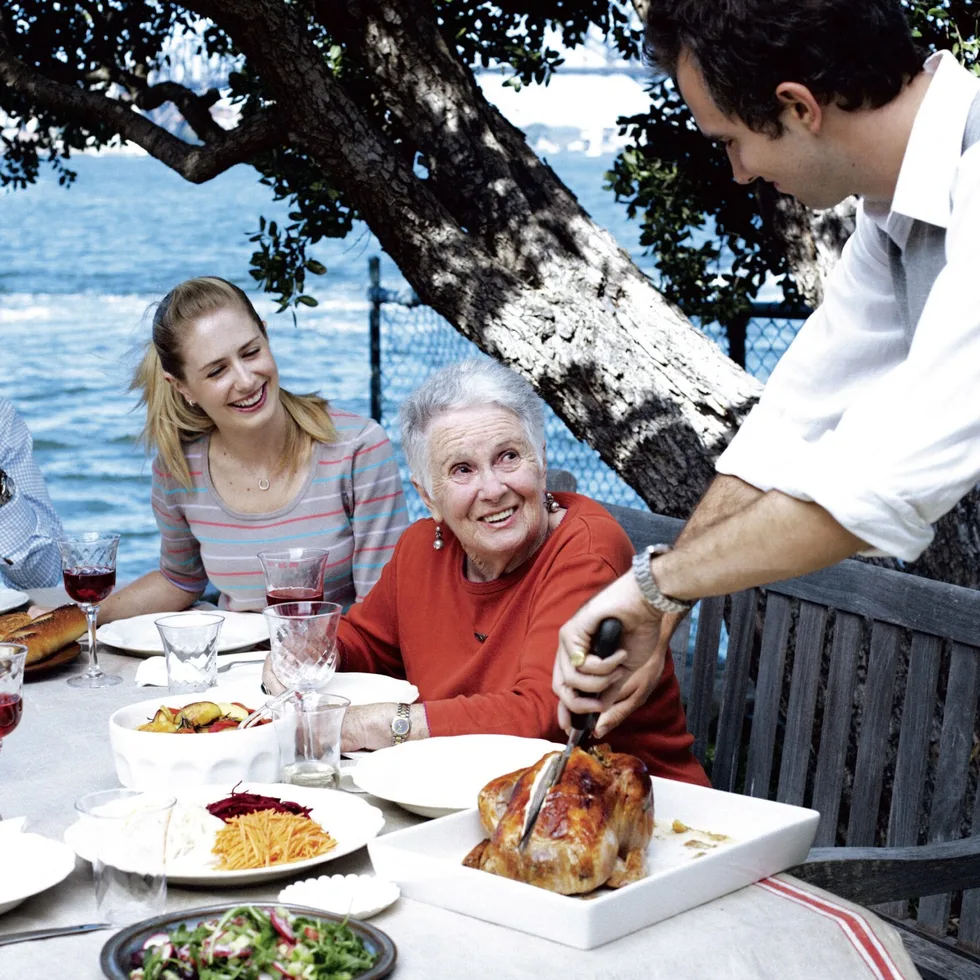 Margaret Fulton's classic French roast chicken recipe served with family