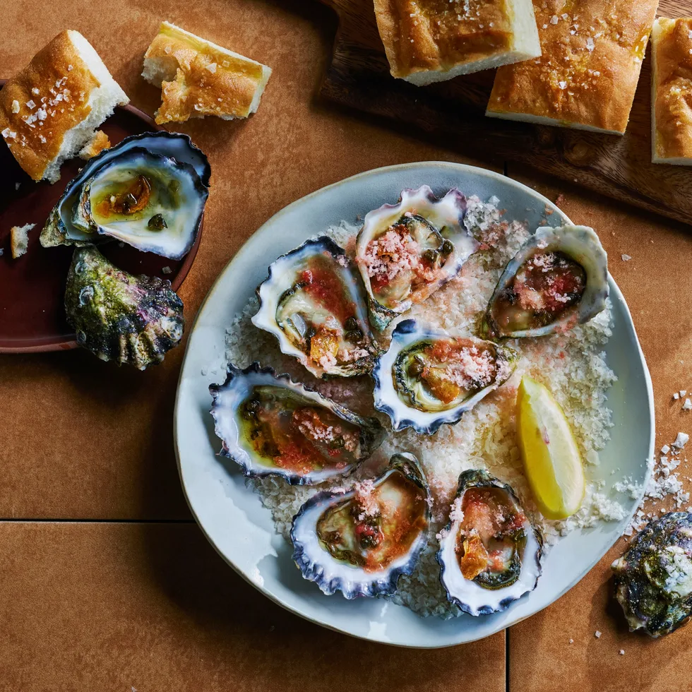 Oysters with crispy capers and chilled tomato.