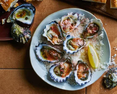 Oysters with crispy capers and chilled tomato.