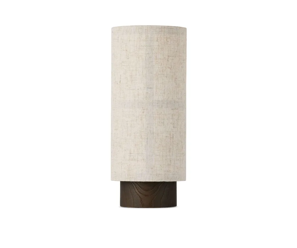 A fabric cordless lamp with a cylindrical shape.
