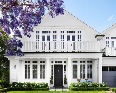 The facade of a white Cape Cod style home on Sydney's lower north shore.