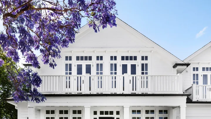 The facade of a white Cape Cod style home on Sydney's lower north shore.