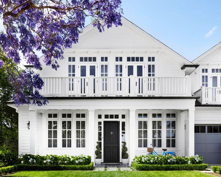 The facade of a white Cape Cod style home on Sydney's lower north shore.