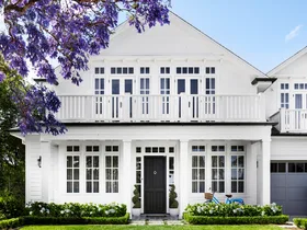 The facade of a white Cape Cod style home on Sydney's lower north shore.