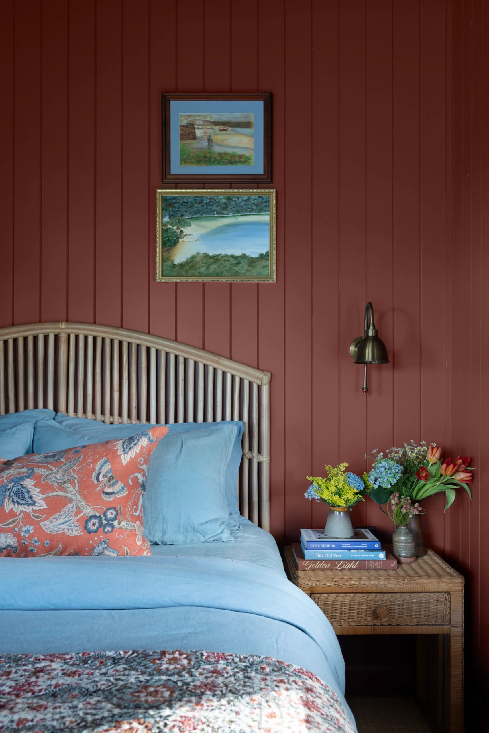 A red bedroom inside a century old cottage renovation. 