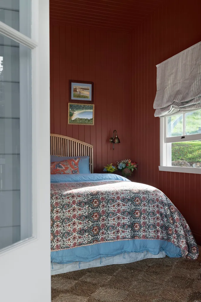 The red bedroom inside a century-old cottage renovation.