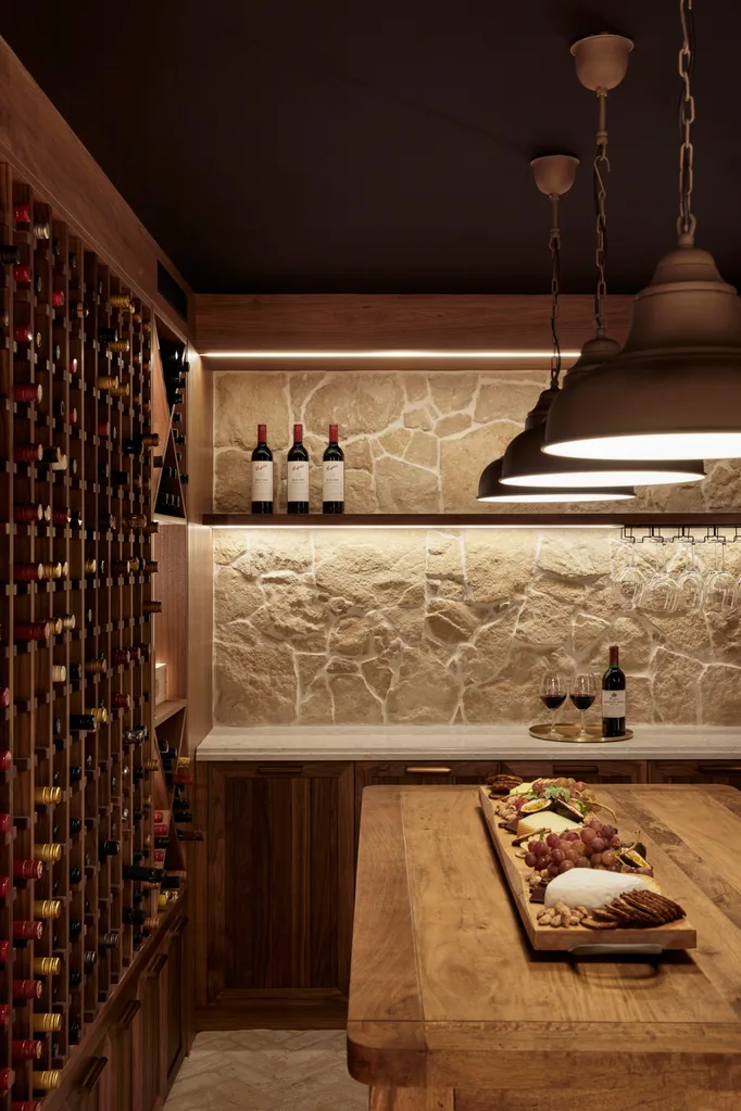 Alisa and Lysandra Brighton bungalow wine cellar stone cladding wall