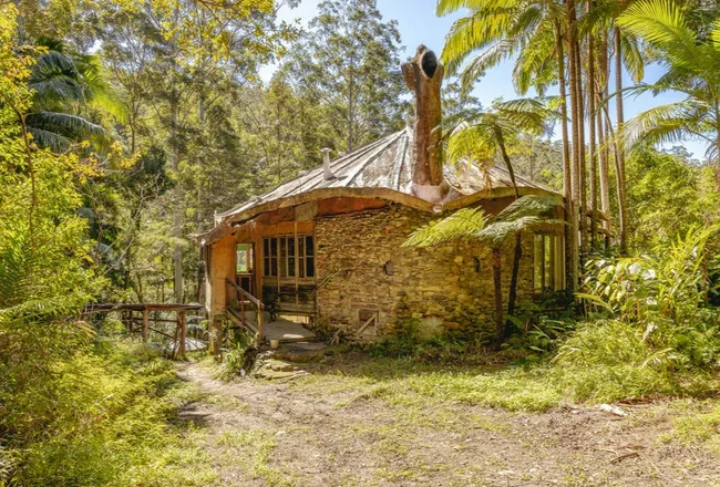 a stone dwelling on a wilderness property