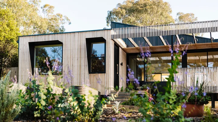 The façade of a sustainable Melbourne tree top home.