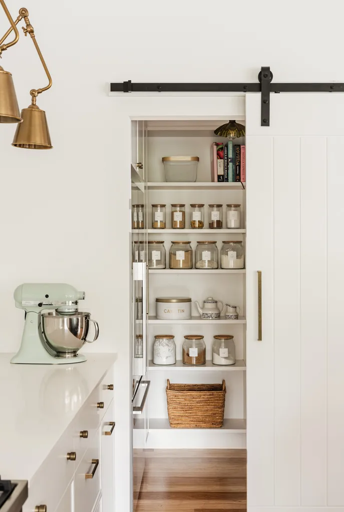Walk in pantry with jars on display