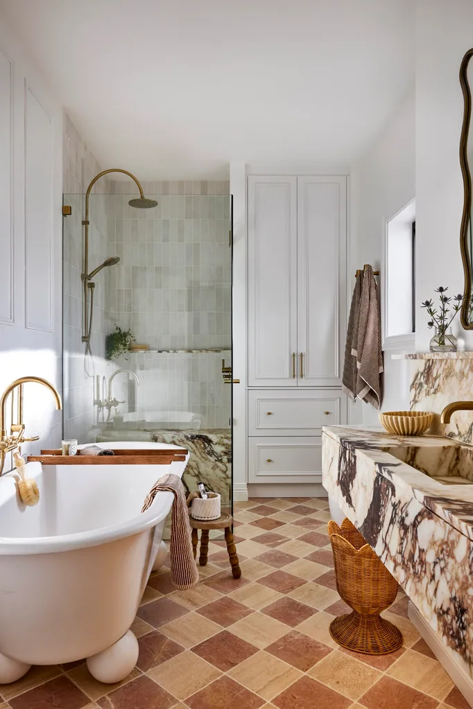 Californian bungalow renovation main bathroom with travertine checkerboard tiles, freestanding bath and marble vanity