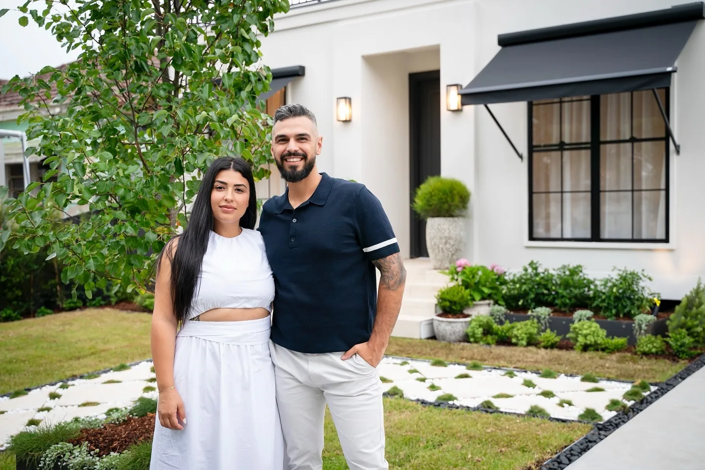 Jacinta and Jordan Dream Home contestants in front of their new home