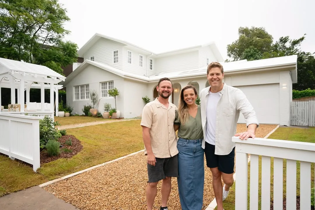 Lara and Peter Dream Home team with Dr Chris Brown outside their place