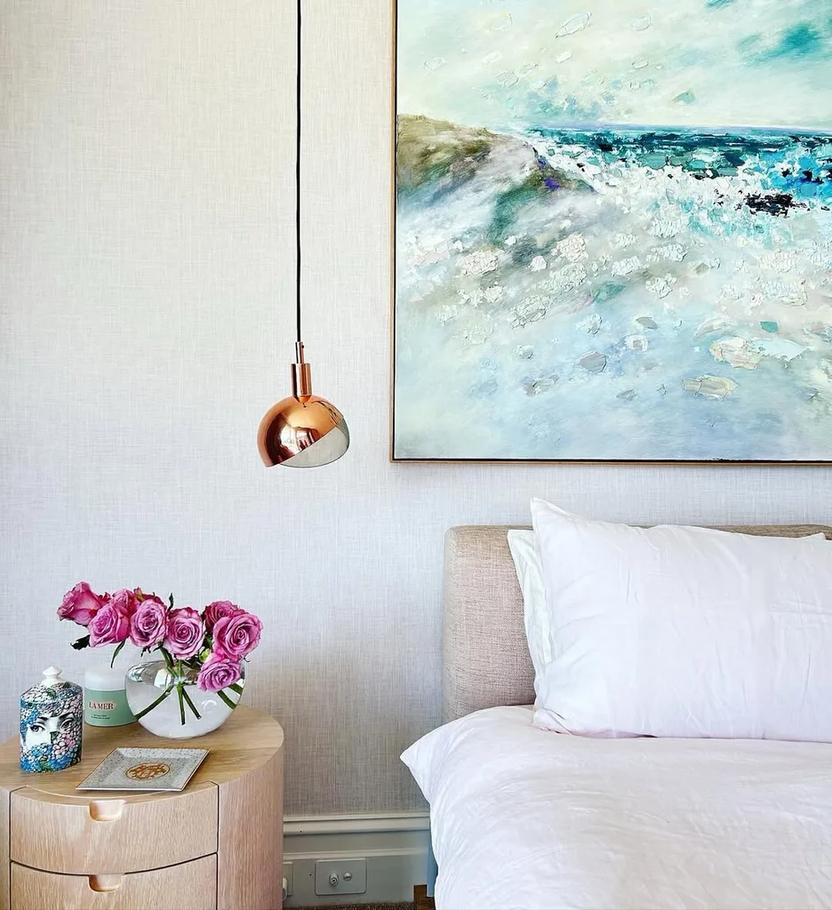 Martine Chippendale's bedroom with timber bedside table and Colin Pennock artwork