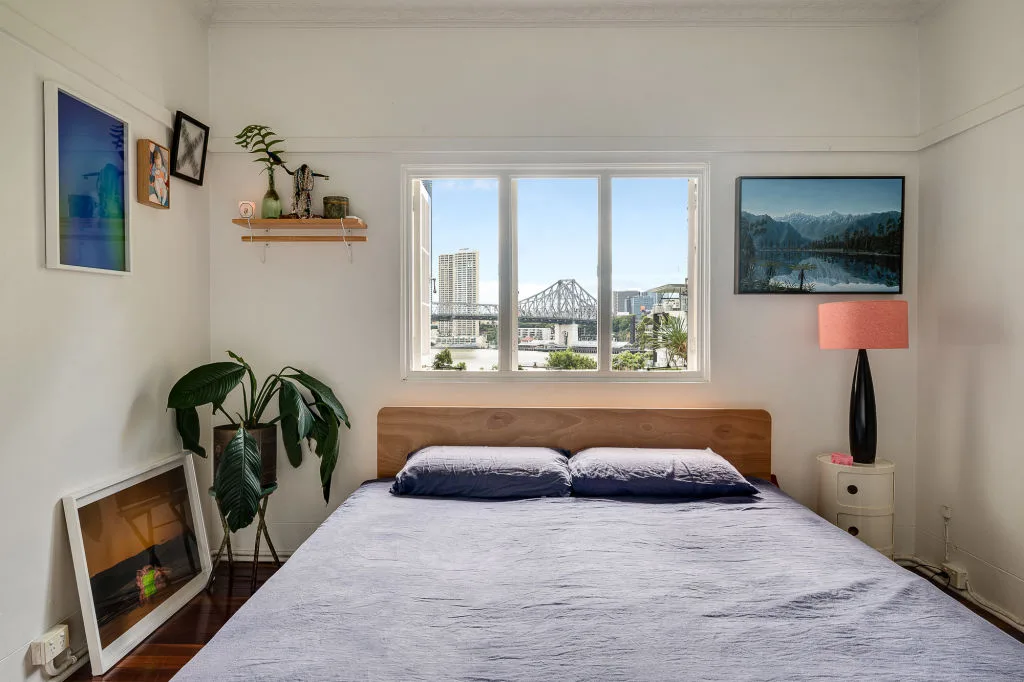 The bedroom in Meg Washington's apartment with view of the bridge