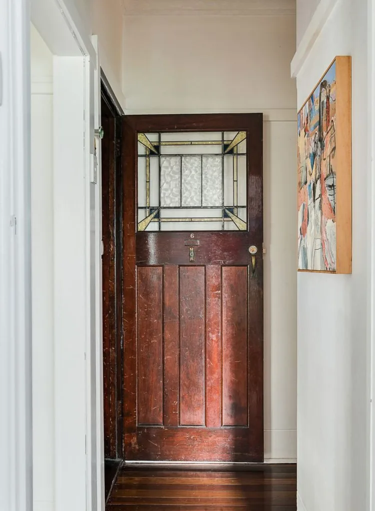 The Art Deco ornate timber door with glass inset windows in Meg Washington's home