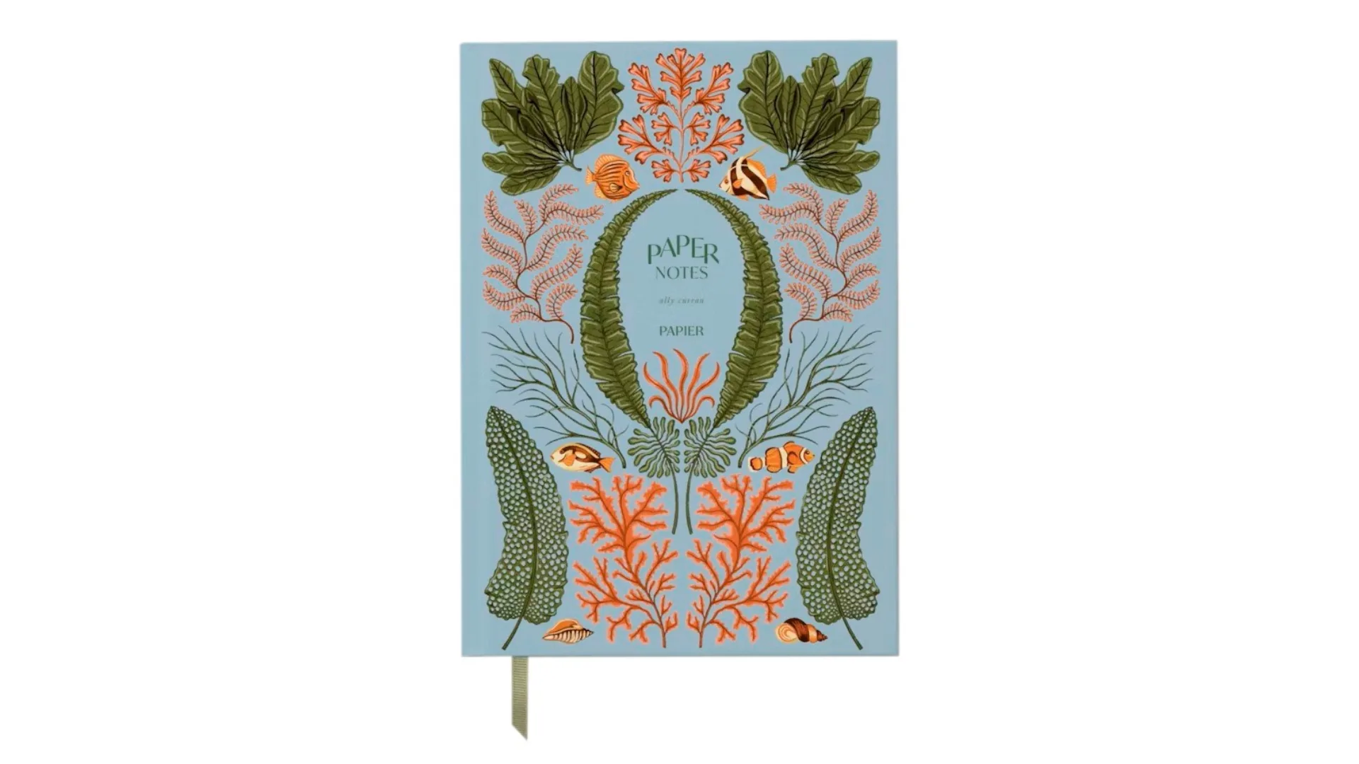 A bullet journal with aquatic motifs on the cover.