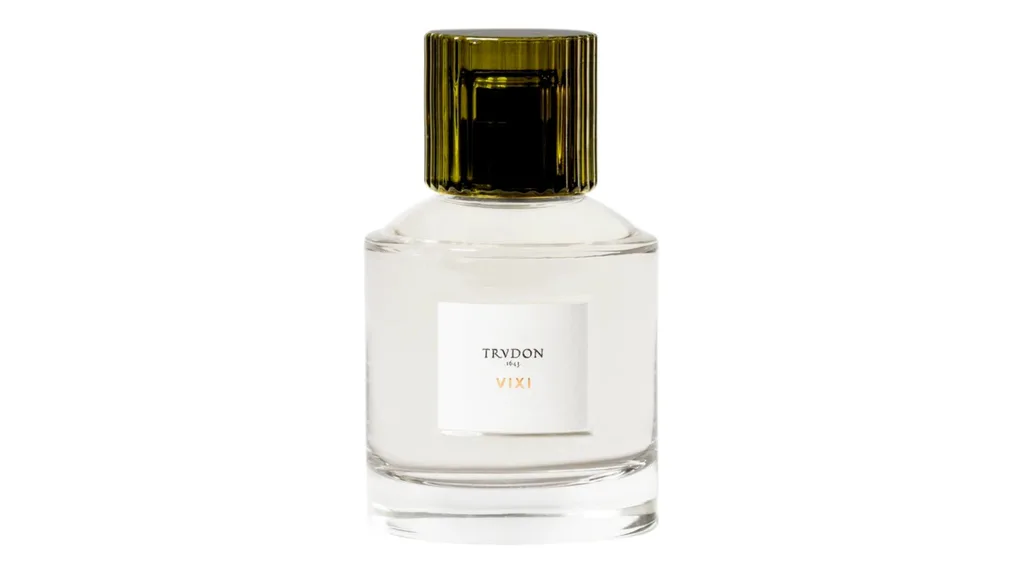 A bottle of perfume with a green lid and clear bottle.