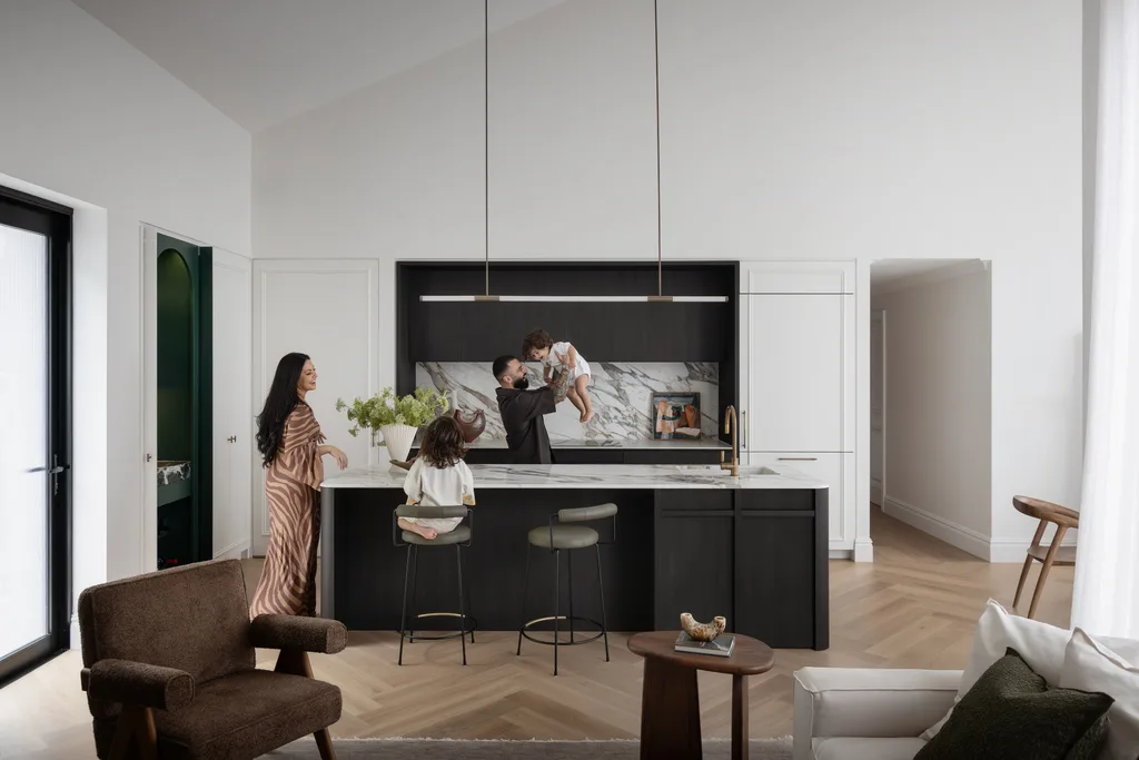 Sarah Marie and Matty from Gogglebox with their children in a monochrome modern kitchen
