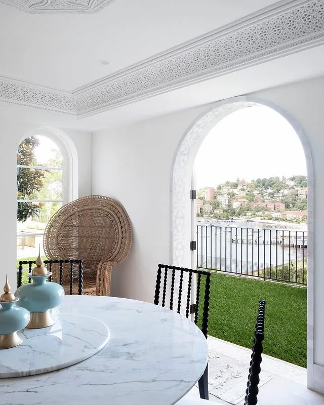 Victoria Montano's breakfast table overlooking lawn and Sydney Harbour