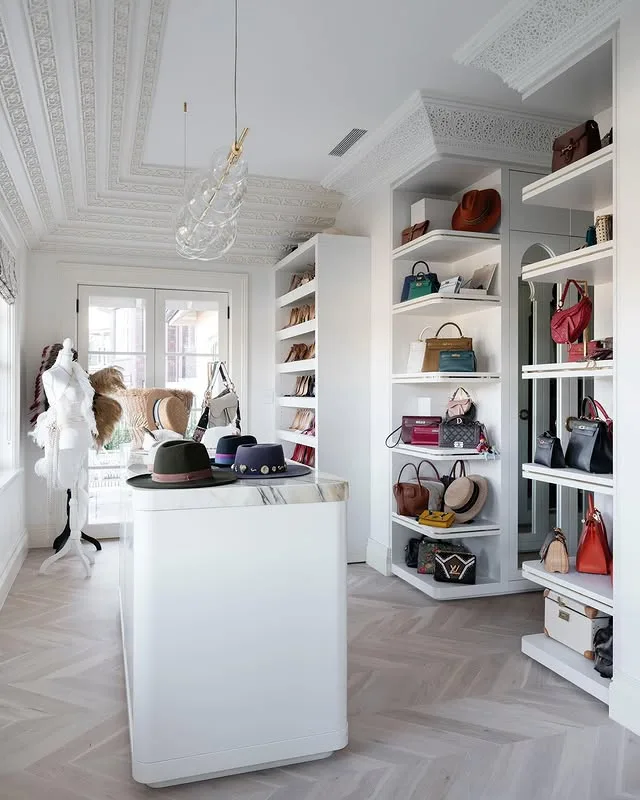 Victoria Montano's walk-in wardrobe featuring hats and bags.