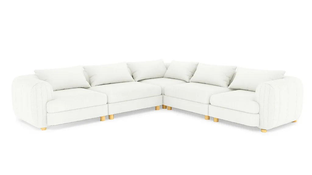A white 5-seater boucle modular sofa from Luxo Living.