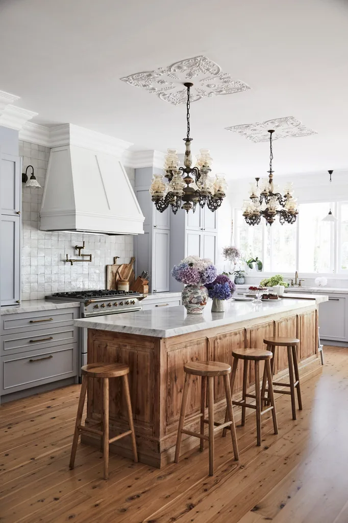 Alexandra Nea's kitchen with chandeliers over bench