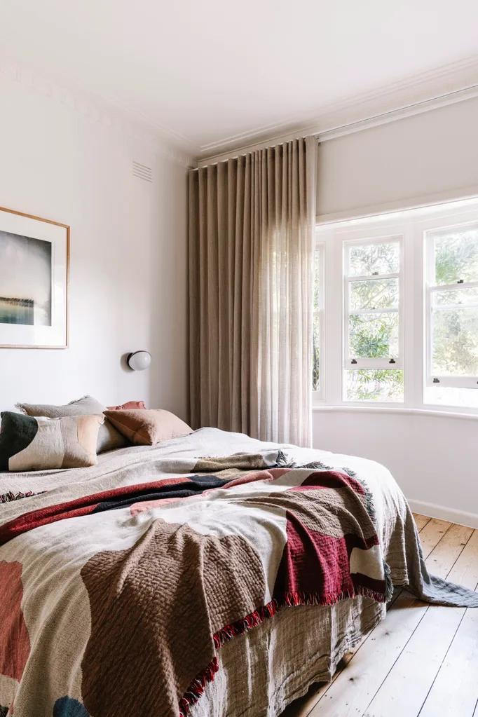 Beige, red and brown bedroom.