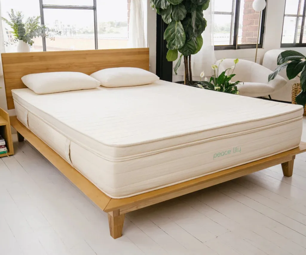 peace lily mattress protector sitting on mattress and wooden bed