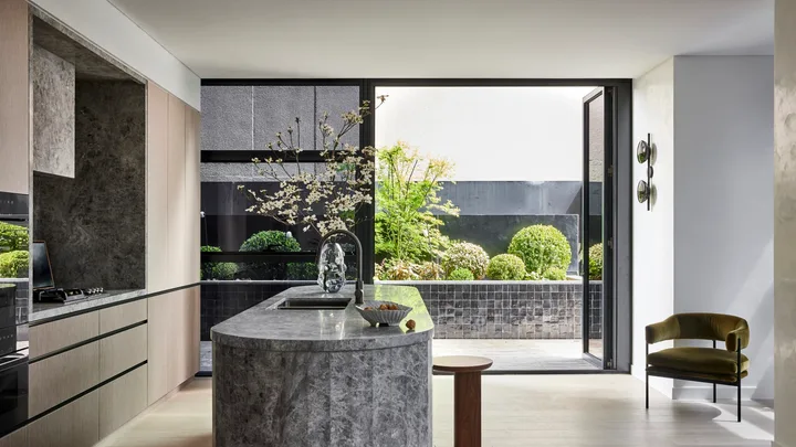 A modern kitchen island is the crowning glory in this apartment