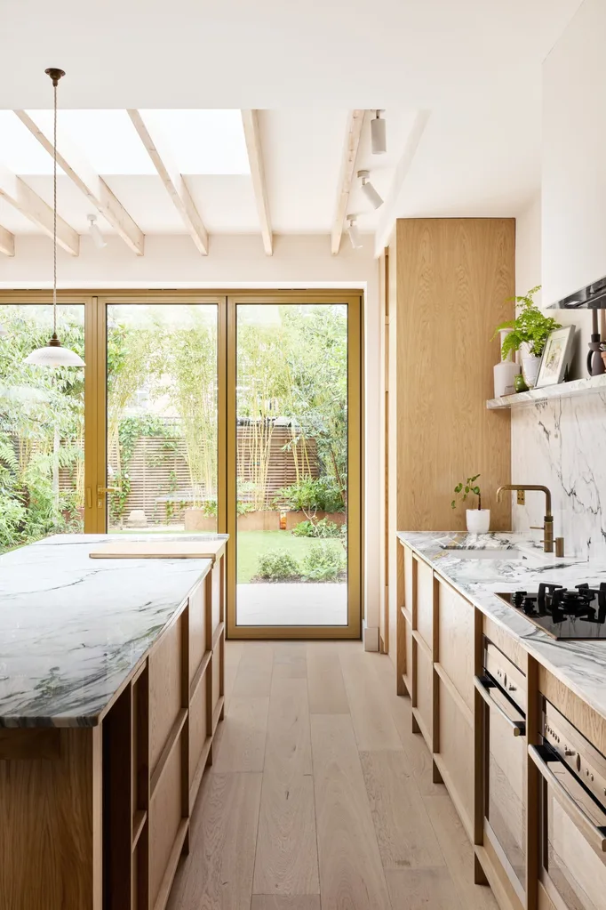 light timber scandinavian and japanese inspired marble kitchen with skylights