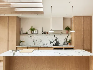 Light timber scandinavian and japanese inspired marble kitchen benchtop and splashback with pendant lights