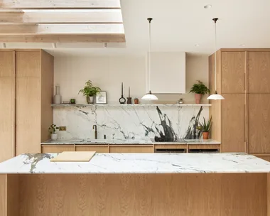 Light timber scandinavian and japanese inspired marble kitchen benchtop and splashback with pendant lights
