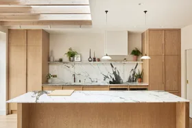 Light timber scandinavian and japanese inspired marble kitchen benchtop and splashback with pendant lights