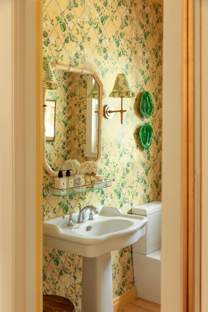 Bathroom with pedestal basin and yellow floral wallpaper