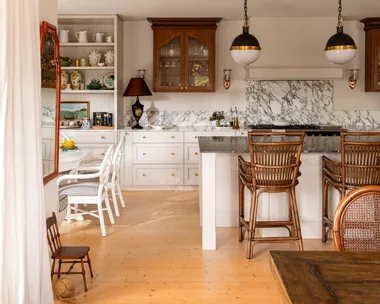 Kitchen with vintage style pendants and marble splashback
