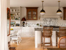 Kitchen with vintage style pendants and marble splashback