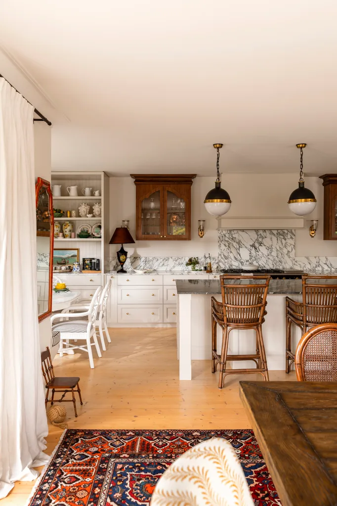 Kitchen with vintage style pendants and marble splashback