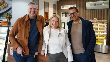 selling houses australia hosts dennis scott, wendy moore and andrew winter pose for a photograph outside a bakery
