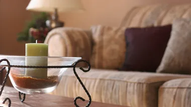 Living room with a candle on the center table
