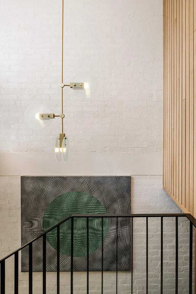 A pendant light in a stairwell.
