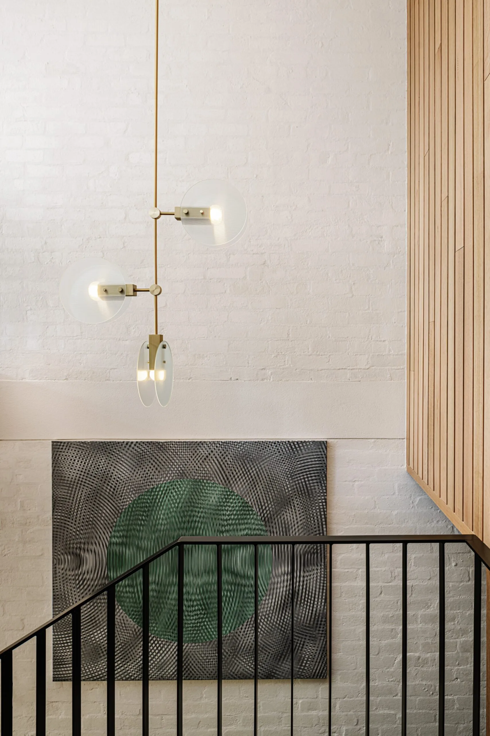 A pendant light in a stairwell. 