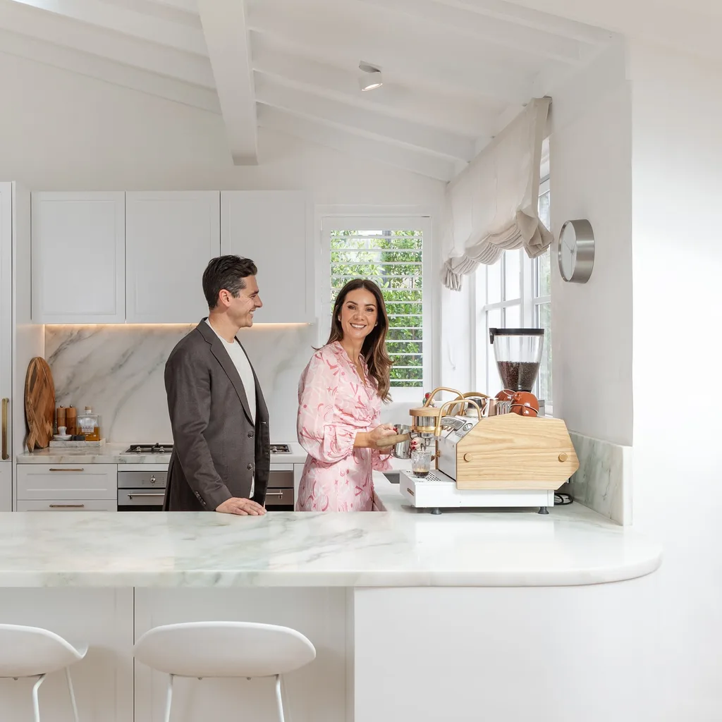 Marty Fox in his Toorak home kitchen with wife Charlotte
