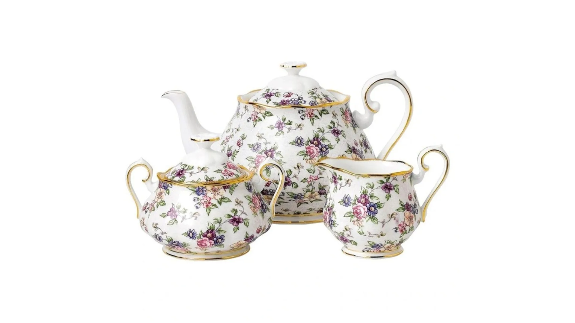 A teapot and two teacups with a floral pattern