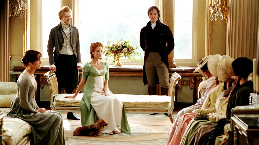 A still from the 2005 Pride and Prejudice movie, with Mr Darcy, Mr Bingley and Caroline Bingley hosting the Bennet sisters and Mrs Bennet at Pemberley.