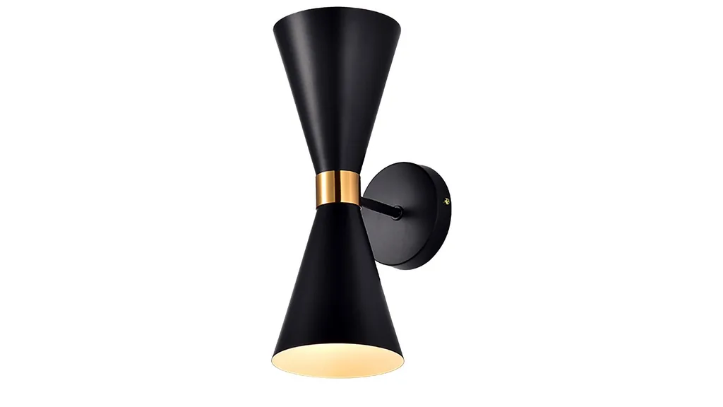 A black and brass wall sconce